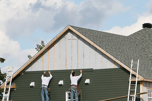Professional Storm Damage Siding Repair technician working in Loysburg, PA